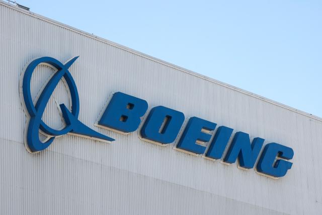 (FILES) Boeing's logo is pictured at the company's Renton factory in Renton, Washington, on April 15, 2025. Boeing reported its first annual profit since 2018 on January 27, 2026, on gains from an asset sale, as it eyes increased plane production while pointing to progress emerging from a lengthy slump. Full-year 2025 profits were $1.9 billion, Boeing reported, compared with a loss of $11.9 billion in 2024. (Photo by Jason Redmond / AFP)