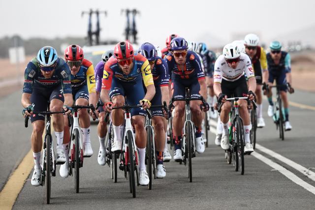 Lidl-Trek cycling team's Italian rider Jonathan Milan (3rd L) rides during the first stage of the AlUla Tour cycling race, a 158 km race started and finished in the Saudi desert city of AlUla, on January 27, 2026. (Photo by Anne-Christine POUJOULAT / AFP)