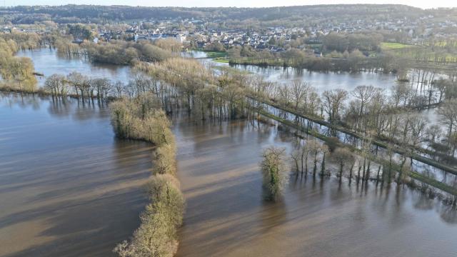 This aerial photoraph shows a flooded area near Malestroit, western France, on January 27, 2026. (Photo by Damien MEYER / AFP)