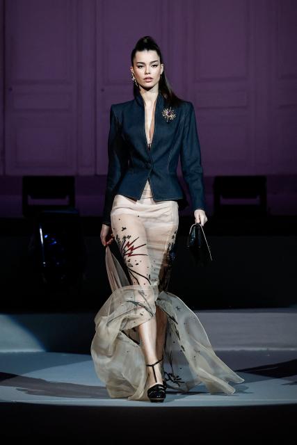 A model presents a creation by Julien Fournie for Women's Haute Couture Spring/Summer 2026 collection fashion show as part of the Paris Haute Couture Fashion Week, in Paris, on January 27, 2026. (Photo by Sebastien DUPUY / AFP)