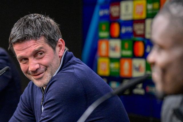 Inter Milan's Romanian head coach Cristian Chivu (L) reacts during a press conference with Inter Milan's German defender #31 Yann Aurel Bisseck on January 27, 2026 in Dortmund, western Germany, on the eve of the UEFA Champions League league phase - day 8 football match between Borussia Dortmund and Inter Milan. (Photo by SASCHA SCHUERMANN / AFP)