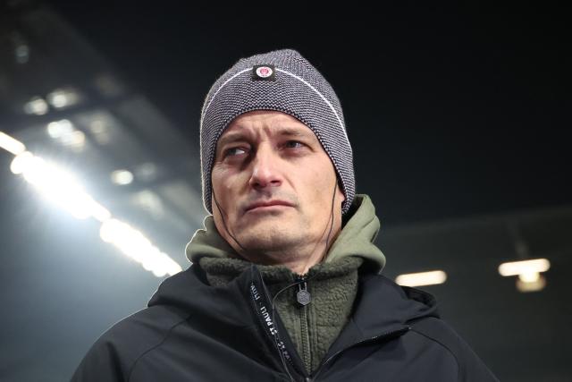 St Pauli's German head coach Alexander Blessin reacts prior to the start of the German first division Bundesliga football match between FC St. Pauli and RB Leipzig in Hamburg, northern Germany on January 27, 2026. (Photo by Ibrahim OT / AFP) / DFL REGULATIONS PROHIBIT ANY USE OF PHOTOGRAPHS AS IMAGE SEQUENCES AND/OR QUASI-VIDEO
