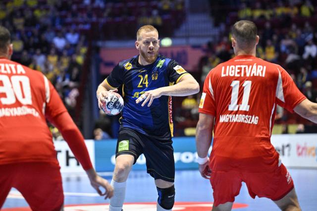 Sweden's centre back #24 Jim Gottfridsson (C) controls the ball during the men's EHF Euro 2026 main round handball match Sweden v Hungary in Malmoe, Sweden, on January 27, 2026. (Photo by Johan Nilsson/TT / TT NEWS AGENCY / AFP) / Sweden OUT