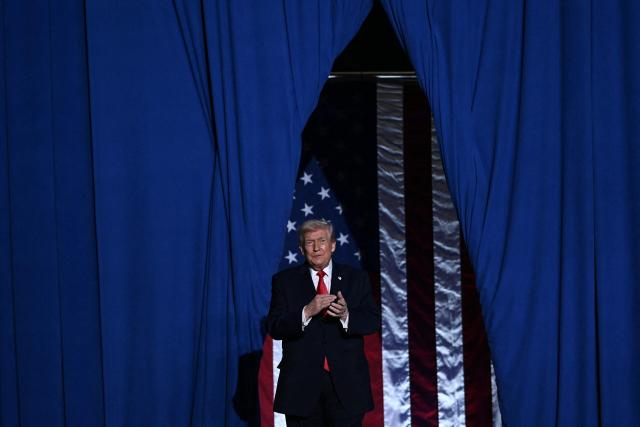 US President Donald Trump arrives to deliver remarks in Clive, Iowa, on January 27, 2026. (Photo by Brendan SMIALOWSKI / AFP)