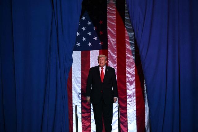 US President Donald Trump arrives to deliver remarks in Clive, Iowa, on January 27, 2026. (Photo by Brendan SMIALOWSKI / AFP)