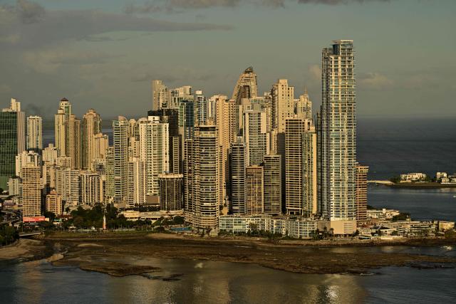 This view shows the skyline of Panama City, taken on January 27, 2026. The Latin America and Caribbean International Economic Forum 2026, organized by CAF (the Development Bank of Latin America and the Caribbean) in partnership with the Government of Panama, brings together business leaders and regional figures. (Photo by MARTIN BERNETTI / AFP)