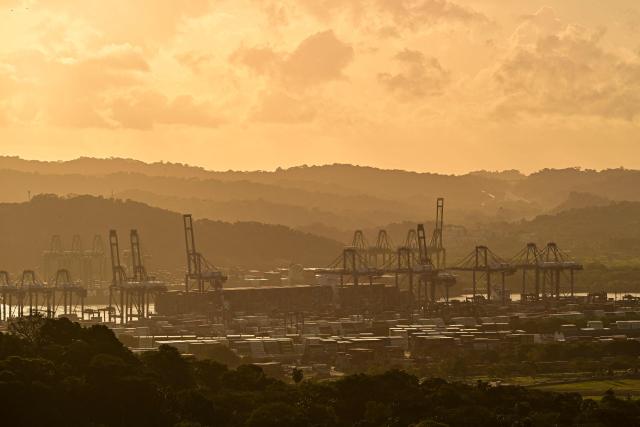 “This view shows the Port of Balboa at sunset in Panama City on January 27, 2026. The Latin America and Caribbean International Economic Forum 2026, organized by CAF (the Development Bank of Latin America and the Caribbean) in partnership with the Government of Panama, brings together business leaders and regional figures. (Photo by MARTIN BERNETTI / AFP)