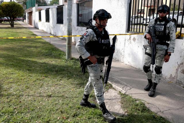 Members of the National Guard patrol the area where a hotel owner was attacked, an incident that left one assailant dead in a hospital and five people wounded by gunfire in a commercial area of Zapopan, Jalisco, Mexico on January 27, 2026. (Photo by ULISES RUIZ / AFP)