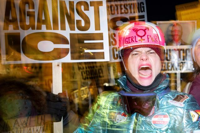 A group of anti-US Immigration and Customs Enforcement (ICE) protesters shout slogans in downtown Minneapolis, Minnesota, on January 27, 2026. US President Donald Trump said on January 27 that he would "de-escalate a little bit" in Minneapolis after the fatal shootings of two civilians fueled a storm of criticism over his signature immigration crackdown. (Photo by ROBERTO SCHMIDT / AFP)