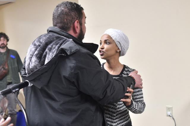 US Representative Ilhan Omar (D-MN) (R) reacts after being sprayed with an unknown substance by a man as she hosted a town hall in Minneapolis, Minnesota, on January 27, 2026. (Photo by Octavio JONES / AFP)