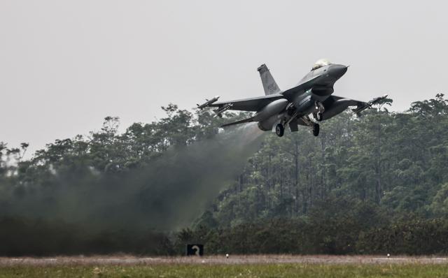 A Taiwan F-16V fighter jet takes off as part of a spring military exercise at Chiayi Air Base, in Chiayi on January 28, 2026. (Photo by I-Hwa Cheng / AFP)
