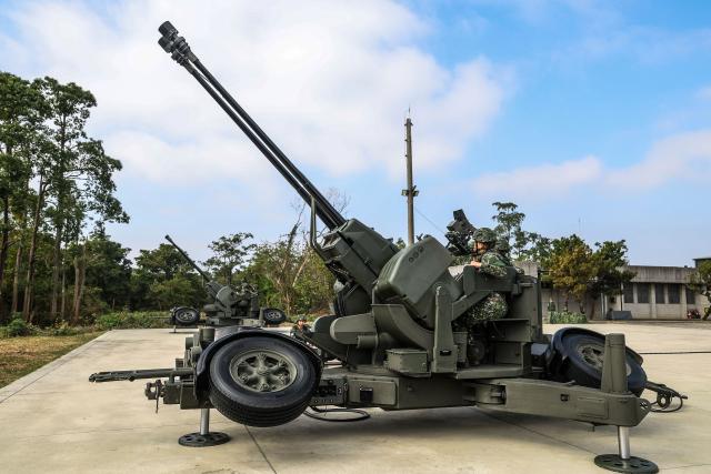 Taiwan military personnel operate Oerlikon 35 mm twin cannon during Spring military exercise at Chiayi Air Base, in Chiayi on January 28, 2026. (Photo by I-Hwa Cheng / AFP)