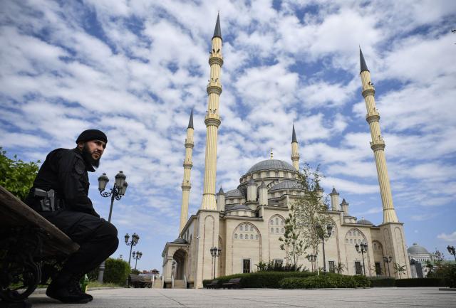 (FILES) A Chechen policeman guards in front of the Heart of Chechnya - Akhmad Kadyrov Mosque in Grozny on July 26, 2019. (Photo by Alexander NEMENOV / AFP)