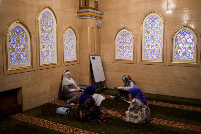(FILES) Women attend an Arabic language class inside the Heart of Chechnya - Akhmad Kadyrov Mosque, one of the largest mosques in Russia, in central Grozny on July 26, 2017. (Photo by Kirill KUDRYAVTSEV / AFP)