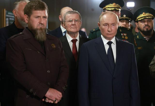 (FILES) In this pool photograph distributed by Russian state owned Sputnik agency Russia's President Vladimir Putin (C-R) and  head of the Chechen Republic Ramzan Kadyrov (L) visit the "Russian Spetsnaz University" special force training centre in Gudermes on August 20, 2024. (Photo by Vyacheslav PROKOFYEV / POOL / AFP) / Editor's note : this image is distributed by Russian state owned agency Sputnik