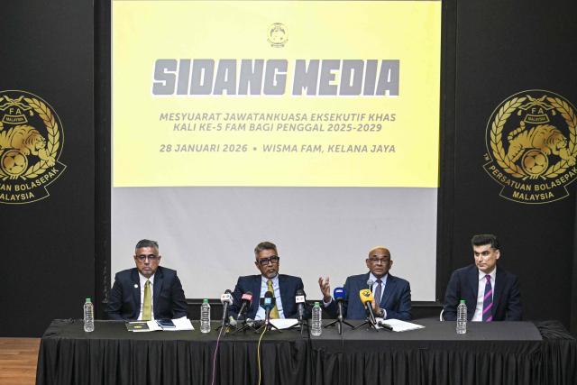 Asian football confederation (AFC) general secretary Windsor John (2nd R) talks as his deputy Vahid Kardany (R), Malaysian football association's (FAM) acting president Yusoff Mahadi (2nd L) and FAM's secretary general Noor Azman Rahman (L) listen during a press conference at the FAM's headquarters in Kuala Lumpur on January 28, 2026. The Malaysian football association's entire executive committee resigned on January 28, due to an ongoing eligibility scandal linked to forged documents used in Asian Cup qualifying games. (Photo by Mohd Rasfan / AFP)