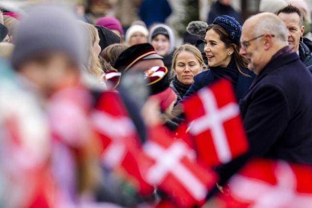 Queen Mary of Denmark (2ndR) greet the gathered citizens during an official welcome at the Town Hall Square in Tallinn, on January 27, 2026. The royal couple is on a state visit to Estonia from January 27-28, 2026. The visit particularly focuses on digital resilience and cybersecurity. (Photo by Ida Marie Odgaard / Ritzau Scanpix / AFP) / Denmark OUT
