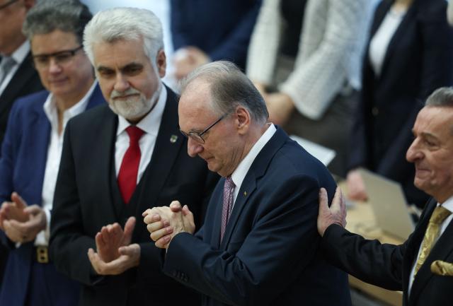 Saxony-Anhalt's outgoing State Premier Reiner Haseloff (2ndR) is applauded at Saxony-Anhalt's State Parliament, on January 28, 2026 in Magdeburg, eastern Germany, prior to the election of the new regional leader. After roughly 15 years in office, Haseloff will not run in Saxony-Anhalt's state elections scheduled on September 6, 2026. (Photo by Ronny HARTMANN / AFP)