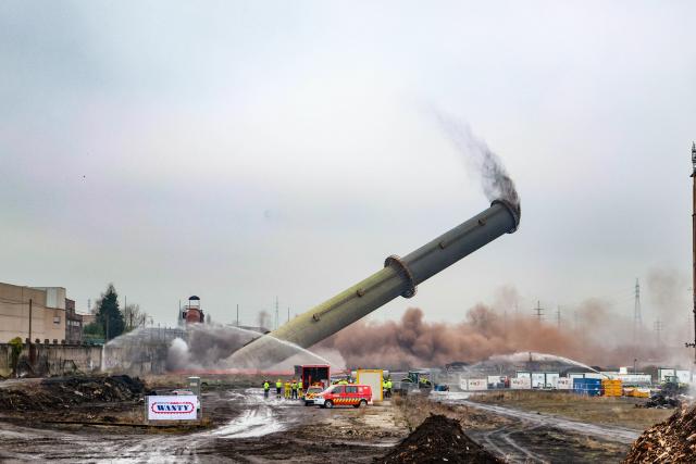 This picture shows the demolition of the two chimneys of the former Ougree blast furnace B, on January 28, 2026 in Ougree. (Photo by BRUNO FAHY / Belga / AFP) / Belgium OUT
