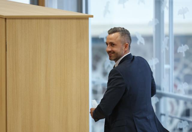 Saxony-Anhalt's far-right Alternative for Germany (AfD) top candidate Ulrich Siegmund goes to the voting booth at Saxony-Anhalt's State Parliament, on January 28, 2026 in Magdeburg, eastern Germany, prior to the election of Saxony-Anhalt's new regional leader. After roughly 15 years in office, Saxony-Anhalt's outgoing State Premier Reiner Haseloff will not run in Saxony-Anhalt's state elections scheduled on September 6, 2026. (Photo by Ronny HARTMANN / AFP)