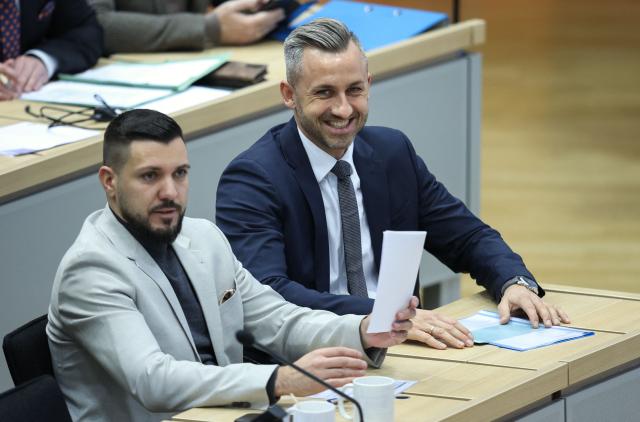 Saxony-Anhalt's far-right Alternative for Germany (AfD) top candidate Ulrich Siegmund (R) and AfD member Tobias Rausch sit in Saxony-Anhalt's State Parliament, on January 28, 2026 in Magdeburg, eastern Germany, prior to the election of Saxony-Anhalt's new regional leader. After roughly 15 years in office, Saxony-Anhalt's outgoing State Premier Reiner Haseloff will not run in Saxony-Anhalt's state elections scheduled on September 6, 2026. (Photo by Ronny HARTMANN / AFP)