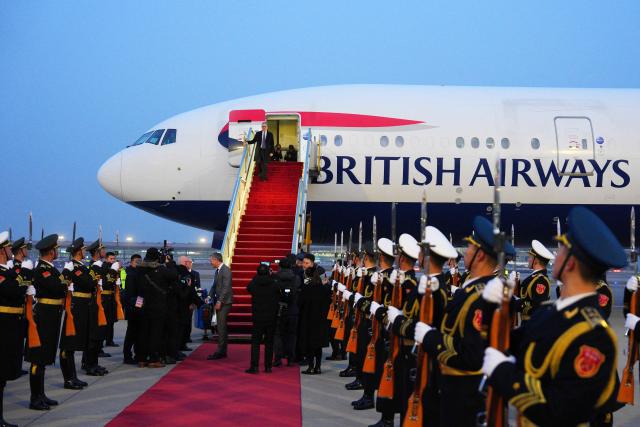 Britain's Prime Minister Keir Starmer alights from his aircraft upon his arrival at an airport in Beijing on January 28, 2026. British Prime Minister Keir Starmer arrived in Beijing on January 28 to meet with Chinese leader Xi Jinping, hoping to restore long fraught relations. (Photo by Carl Court / POOL / AFP)