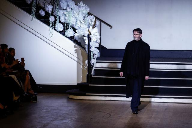 French fashion designer Franck Sorbier acknowledges the audience at the end of Franck Sorbier Women's Haute Couture Spring/Summer 2026 collection fashion show as part of the Paris Haute Couture Fashion Week, in Paris, on January 28, 2026. (Photo by Sebastien DUPUY / AFP)