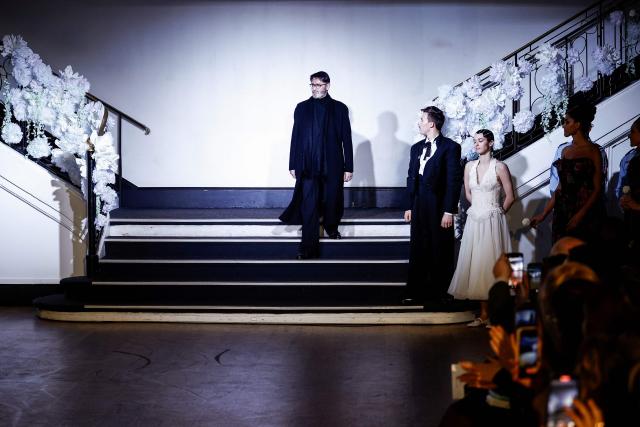 French fashion designer Franck Sorbier acknowledges the audience at the end of Franck Sorbier Women's Haute Couture Spring/Summer 2026 collection fashion show as part of the Paris Haute Couture Fashion Week, in Paris, on January 28, 2026. (Photo by Sebastien DUPUY / AFP)