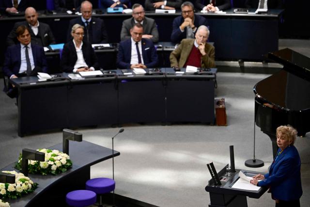 Holocaust survivor Tova Friedman (R) addresses delegates, among them some of Germany's far-right Alternative for Germany (AfD) party (seen in background), and state authorities during a commemoration for the victims of National Socialism at the Bundestag (lower house of parliament) on January 28, 2026 in Berlin. The International Holocaust Remembrance Day takes place every year on January 27, the anniversary of the Red Army's liberation of the Auschwitz-Birkenau Nazi concentration camp. The day commemorates the six million Jewish people murdered during the Holocaust, and the millions more murdered under Nazi persecution. (Photo by Tobias SCHWARZ / AFP)