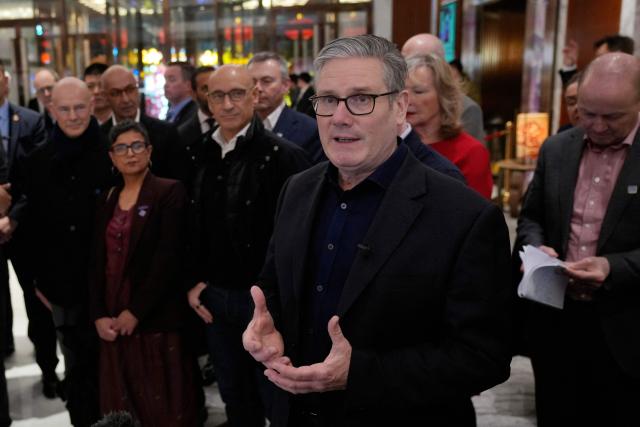 Britain's Prime Minister Keir Starmer delivers remarks to the business delegation at a hotel in Beijing on January 28, 2026. British Prime Minister Keir Starmer arrived in Beijing on January 28 to meet with Chinese leader Xi Jinping, hoping to restore long fraught relations. (Photo by Kin Cheung / POOL / AFP)