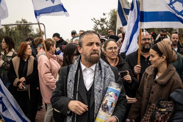 Mourners gather for the funeral of Israeli hostage Ran Gvili, whose remains were finally brought back to Israel on January 26, in the southern town of Meitar on January 28, 2026. Grieving relatives of Ran Gvili gathered on January 28, 2026, as Israel prepared to bury the last hostage returned from Gaza, marking the end of a painful national saga triggered by Hamas's 2023 attack. Israeli forces on January 26 brought home the remains of Gvili, a police officer who was killed in action during Hamas's attack on October 7, 2023 which triggered the devastating war in Gaza. (Photo by JOHN WESSELS / AFP)