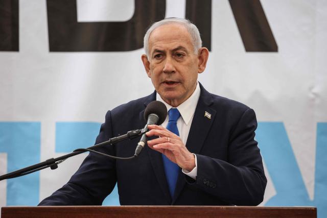 Israel's Prime Minister Benjamin Netanyahu delivers a speech during the funeral of Israeli hostage Ran Gvili, whose remains were finally brought back to Israel on January 26, in the southern town of Meitar on January 28, 2026. Grieving relatives of Ran Gvili gathered on January 28, 2026, as Israel prepared to bury the last hostage returned from Gaza, marking the end of a painful national saga triggered by Hamas's 2023 attack. Israeli forces on January 26 brought home the remains of Gvili, a police officer who was killed in action during Hamas's attack on October 7, 2023 which triggered the devastating war in Gaza. (Photo by ilia yefimovich / AFP)