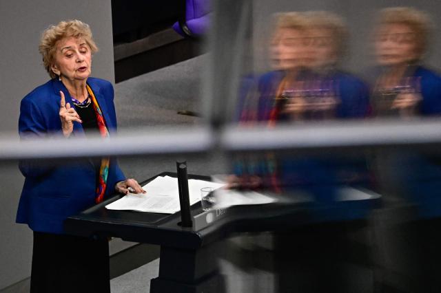 US-Polish Holocaust survivor Tova Friedman is reflected as she speaks in the plenary  during a commemoration in remembrance to the victims of National Socialism at the Bundestag (lower house of parliament) in Berlin, on January 28, 2026. (Photo by Tobias SCHWARZ / AFP)