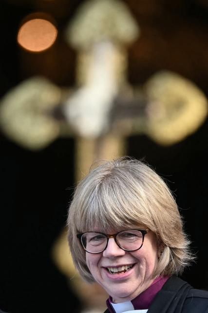 The new Archbishop of Canterbury Sarah Mullally smiles on the steps of St Paul’s Cathedral after taking part in a 'Confirmation of Election' ceremony in London on January 28, 2026. Sarah Mullally, a former nurse, was named as the first female Archbishop of Canterbury last October, pledging to improve safety at the Church of England following an abuse scandal that ousted her predecessor. (Photo by JUSTIN TALLIS / AFP)