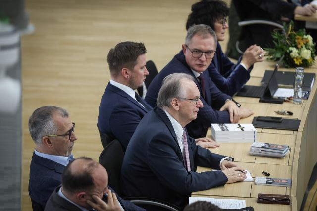 Saxony-Anhalt's outgoing State Premier Reiner Haseloff sits in the back row of his faction at Saxony-Anhalt's State Parliament, on January 28, 2026 in Magdeburg, eastern Germany, after the election of his successor as Saxony-Anhalt's new regional leader. After roughly 15 years in office, Saxony-Anhalt's outgoing State Premier Reiner Haseloff will not run in Saxony-Anhalt's state elections scheduled on September 6, 2026. (Photo by RONNY HARTMANN / AFP)