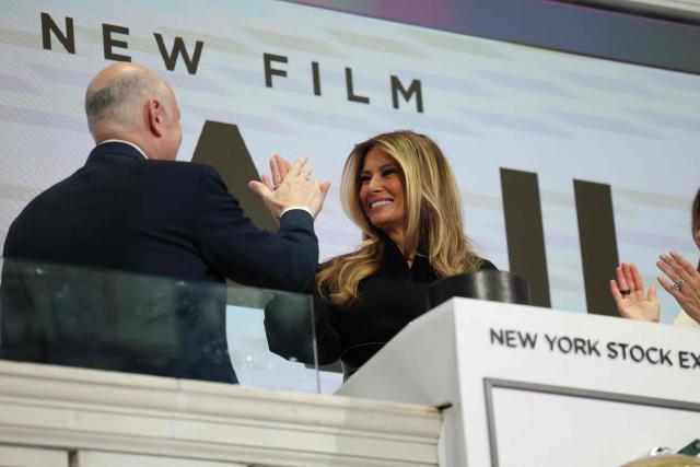US First Lady Melania Trump (C), greets Chairperson of Intercontinental Exchange Jeffrey Sprecher (L), after ringing the opening bell at the New York Stock Exchange (NYSE) in New York on January 28, 2026. (Photo by ANGELA WEISS / AFP)