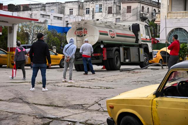 A tanker truck belonging to the state-owned company Cupet unloads fuel at a gas station in Havana on January 28, 2026. (Photo by YAMIL LAGE / AFP)