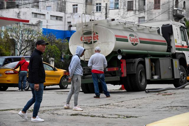 A tanker truck belonging to the state-owned company Cupet unloads fuel at a gas station in Havana on January 28, 2026. (Photo by YAMIL LAGE / AFP)