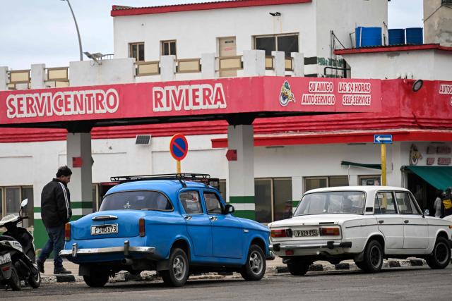 Drivers wait in line to refuel at a gas station in Havana on January 28, 2026. (Photo by YAMIL LAGE / AFP)