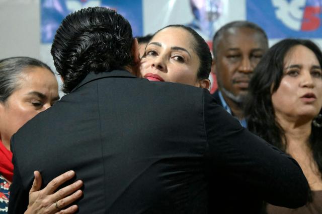 Ecuador's former presidential candidate Luisa Gonzalez is greeted after speaking at a press conference in Quito on January 28, 2025. Ecuador's Prosecutor's Office reported on January 28 that it is investigating alleged financing from Venezuela for the presidential campaign of leftist former candidate Luisa Gonzalez in the elections won by Daniel Noboa. (Photo by Rodrigo BUENDIA / AFP)