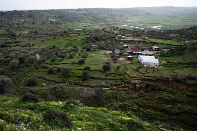 This photograph shows a general view of a landslide in Niscemi on January 28, 2026. More than 1,000 people were evacuated in Sicily after a four-kilometre (2.5-mile) section of cliff crumbled during a storm, leaving houses perched perilously on the edge, authorities said on January 26, 2026. (Photo by MARCO BERTORELLO / AFP)