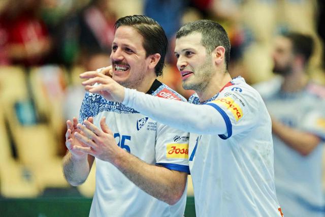 Portugal's right winger #25 Antonio Areia (L) and Portugal's centre back #14 Rui Silva celebrate after the men's EHF Euro 2026 main round handball match Spain vs Portugal in Herning, Denmark, on January 28, 2026. (Photo by Thomas Traasdahl / Ritzau Scanpix / AFP) / Denmark OUT