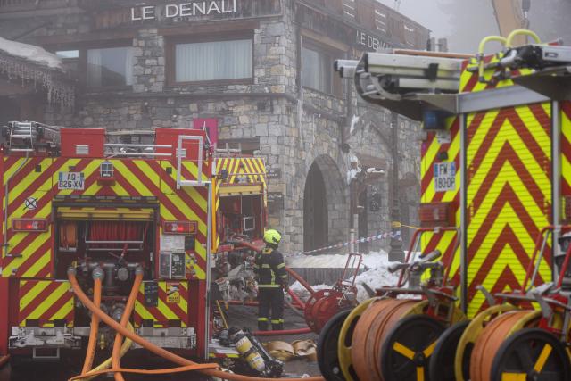 Firefighters work to extinguish a fire that broke out the evening before at the five-star Grandes Alpes hotel in the upscale French Alpine ski resort of Courchevel, southeastern France, forcing the evacuation of 83 occupants, on January 28, 2026. In the afternoon of January 28, 2026, firefighters contained the intense fire that had broken out the previous day in a five-star hotel in the Courchevel ski resort, slightly injuring six of them. (Photo by Alex MARTIN / AFP)