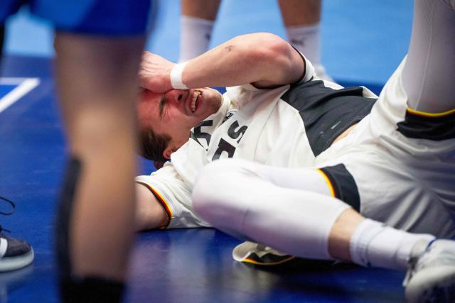 Germany's centre back #15 Juri Knorr reacts on the ground during the men's EHF Euro 2026 main round handball match Germany vs France in Herning, Denmark, on January 28, 2026. (Photo by Bo Amstrup / Ritzau Scanpix / AFP) / Denmark OUT
