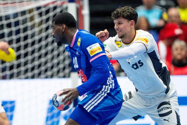 France's right back #10 Dika Mem (L) and Germany's left back #71 Marko Grgic vie for the ball during the men's EHF Euro 2026 main round handball match Germany vs France in Herning, Denmark, on January 28, 2026. (Photo by Bo Amstrup / Ritzau Scanpix / AFP) / Denmark OUT