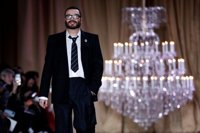 Lebanese fashion designer Zuhair Murad acknowledges the audience during the Zuhair Murad Women's Haute Couture Spring/Summer 2026 collection fashion show as part of the Paris Haute Couture Fashion Week, in Paris, on January 28, 2026. (Photo by Sebastien DUPUY / AFP)