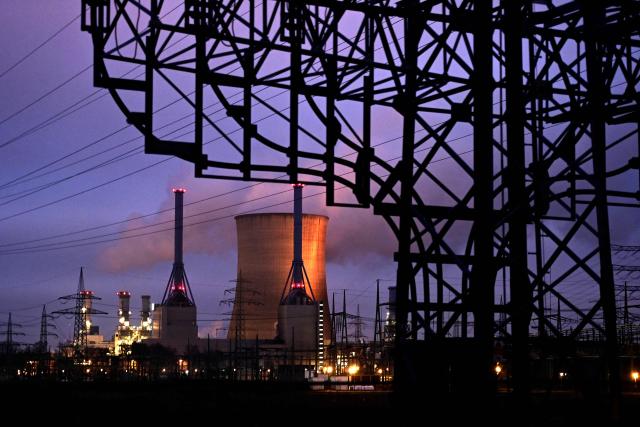 (FILES) An evening view taken on January 12, 2022 shows the gas-fired power plant and power pylons in Lingen, western Germany. Germany plans to better protect its critical infrastructure with a new law on January 29, 2026 as surging tensions with Russia stoke fears of sabotage attacks and other national security threats. Parliament will vote on legislation requiring power utilities, water companies and even some supermarket chains to reduce their vulnerability to terrorism, industrial accidents, natural disasters and public health emergencies. (Photo by Ina FASSBENDER / AFP)