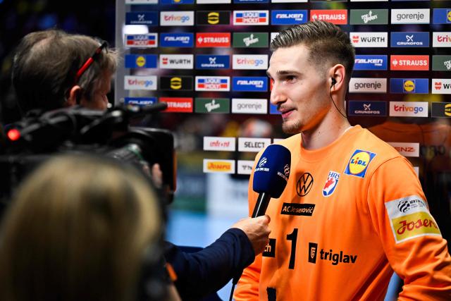 Croatia's goalkeeper #01 Dominik Kuzmanovic speaks to the media after the men's EHF Euro 2026 main round handball match Croatia v Hungary in Malmoe, Sweden, on January 28, 2026. (Photo by Johan Nilsson/TT / TT NEWS AGENCY / AFP) / Sweden OUT