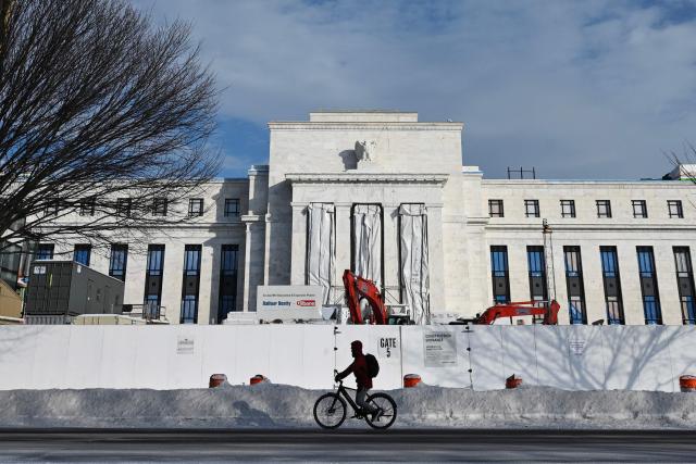 (FILES) A view of the US Federal Reserve building in Washington, DC on January 26, 2026. The US Federal Reserve held interest rates steady on January 28, 2026, at its first policy gathering this year, citing robust economic growth, as the central bank resists President Donald Trump's mounting pressure for cuts. (Photo by Mandel NGAN / AFP)