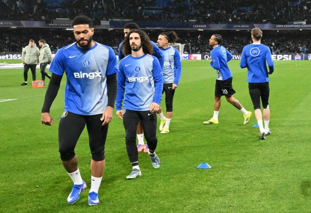 Chelsea's players warm up before the UEFA Champions League - league phase day 8 football match between Napoli and Chelsea at the Diego Armando Maradona stadium in Naples on January 28, 2026. (Photo by Alberto PIZZOLI / AFP)